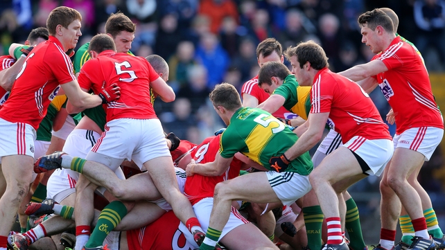 A schmozzle, tending towards a melee, between Cork and Kerry players during the first half