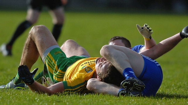 Monaghan's Dermot Malone with Michael Murphy of Donegal