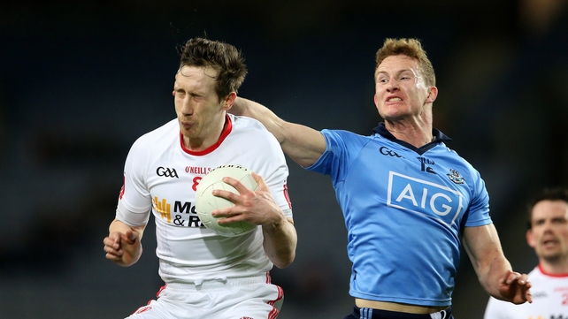 Dublin's Ciaran Kilkenny tackles Colm Kavanagh of Tyrone battle during the game
