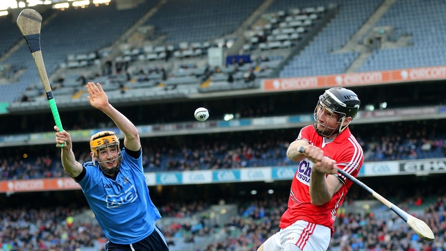 Dublin's Eamonn Dillon attempts to block the clearance of Cork's Mark Ellis
