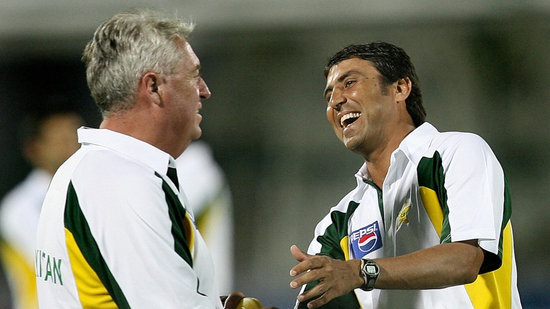 Pakistan cricket coach Bob Woolmer listens to then captain Younis Khan during a training session under floodlights at Swai Man Singh stadium in Jaipur 16 October 2006