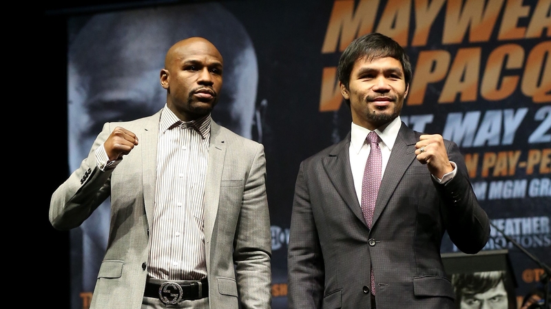 Floyd Mayweather (L) and Manny Pacquiao pose together at the end of their Press Conference