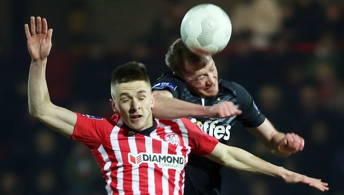 Ryan Curran and Chris Shields do battle for the ball