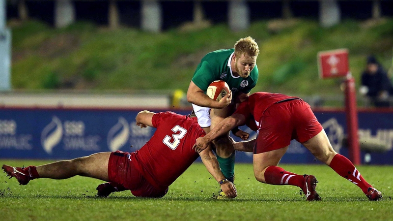 Wales' Dillon Lewis and Luke Garrett tackle Jeremy Loughman of Ireland