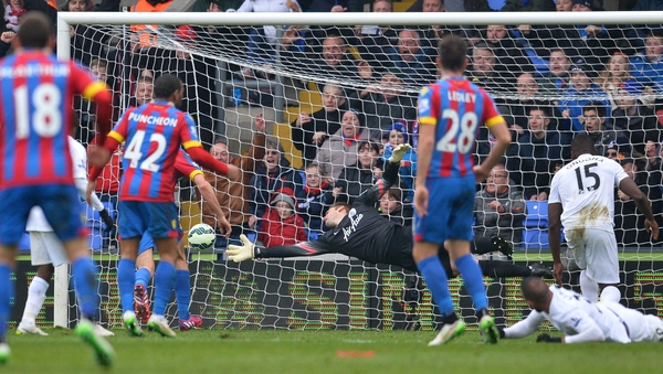 Robert Green is unable to stop Joel Ward's shot as he makes it 3-0