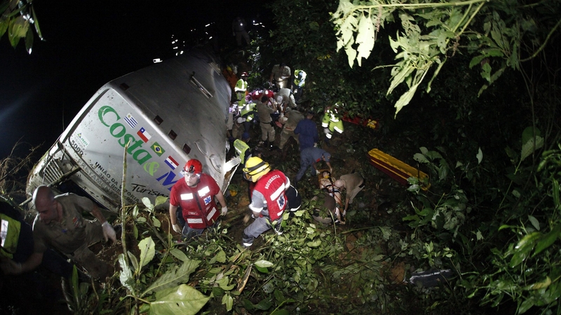 Members of emergency services work at the crash site in Santa Catarina