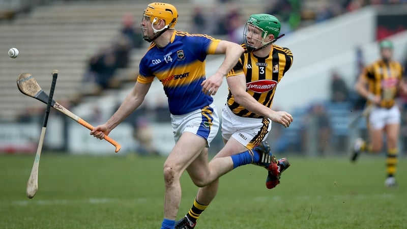 Tipperary's Seamus Callanan evades Paul Murphy and his hurley