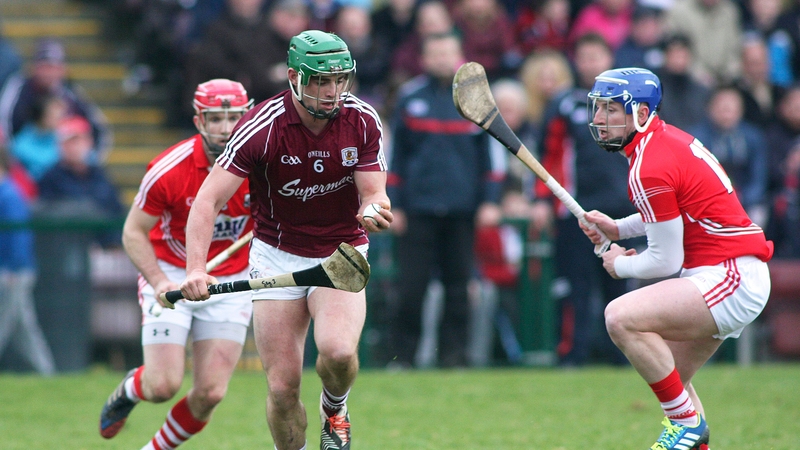 Galway's Greg Lally and Patrick Hogan of Cork battle for possession