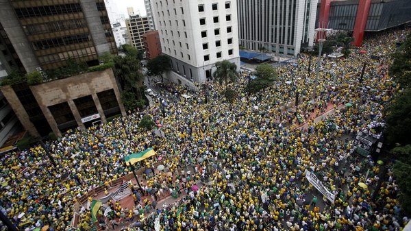 Dressed in the yellow and green of Brazil's flag, many protesters demanded the impeachment of Ms Rousseff