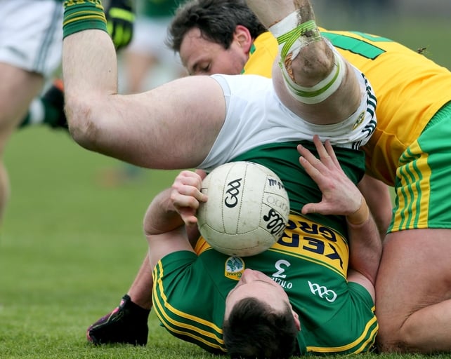 Kerry's Mark Griffin tumbles under pressure from Michael Murphy of Donegal