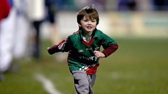 A young Mayo supporter runs onto the pitch at the end of the game against Dublin