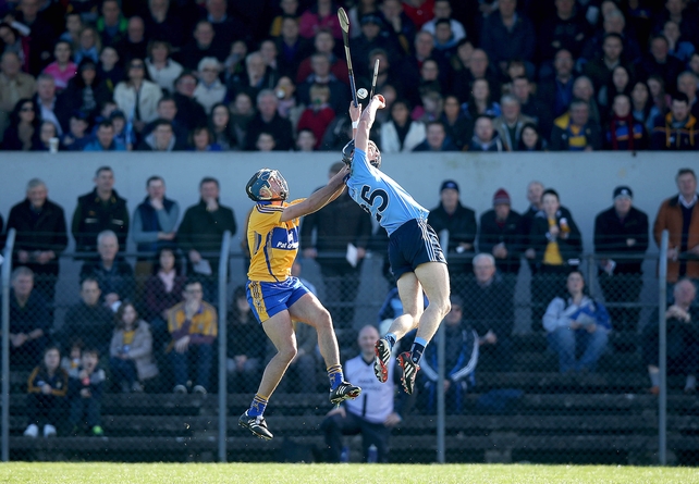 Outstanding athleticism from Mark Schutte of Dublin with Brendan Bugler of Clare