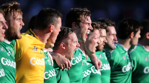 Ross Munnelly and the Ireland players sing the national anthem during the 2014 International Rules Test in Perth