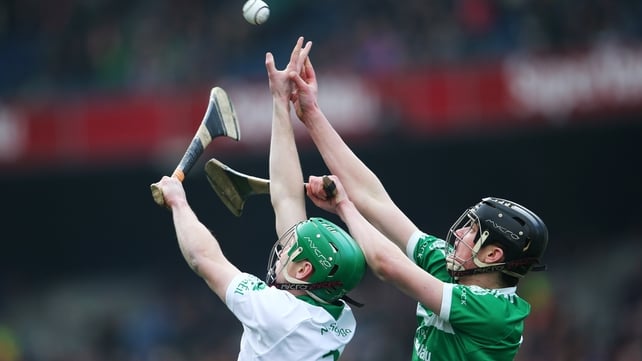 Joey Holden and Paddy O'Loughlin contest the sliotar