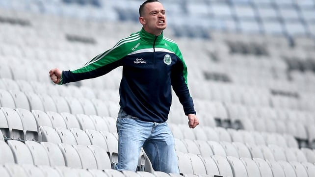 A Kilmallock fan urges his side on...