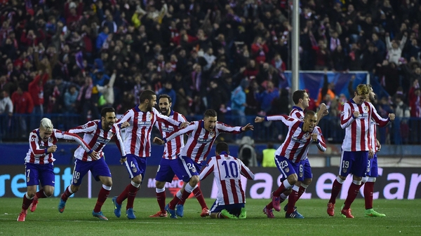 Atletico Madrid players celebrate after their penalty shootout success