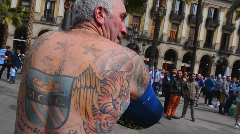 A Man City fan shows off his lovely tattoo