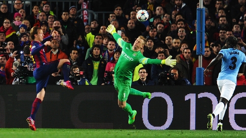 Ivan Rakitic of Barcelona scores past City 'keeper Joe Hart