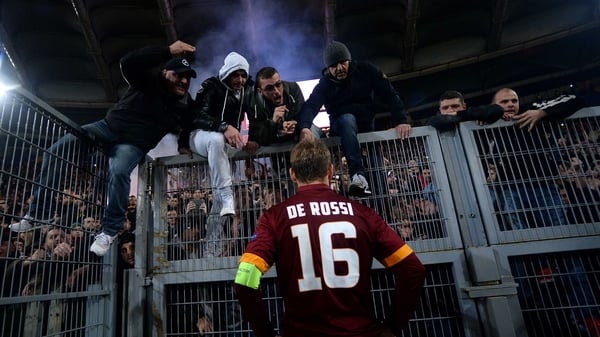 Roma's forward Daniele De Rossi talks to the fans after being defeated 3-0