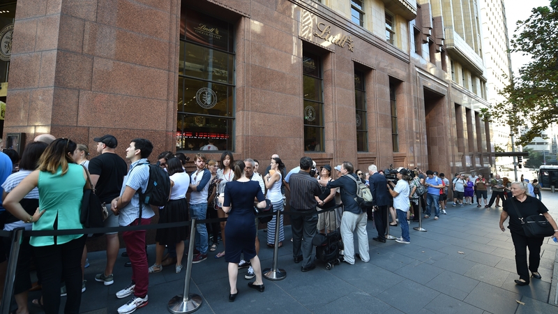 People queue up outside the café this morning
