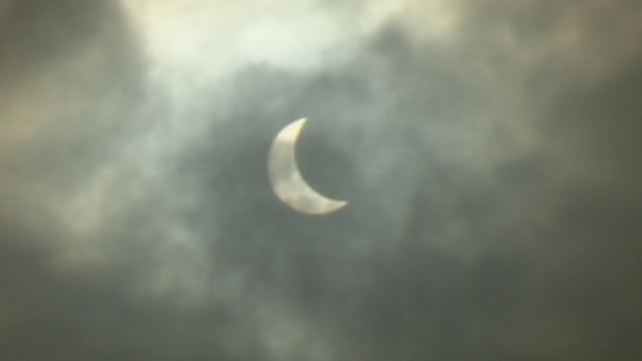 The crescent sun - the moon moves across to block out much of the sun