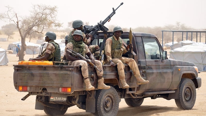 Nigerian soldiers patrol a refugee camp following recent Boko Haram attacks in the Diffa region of Niger