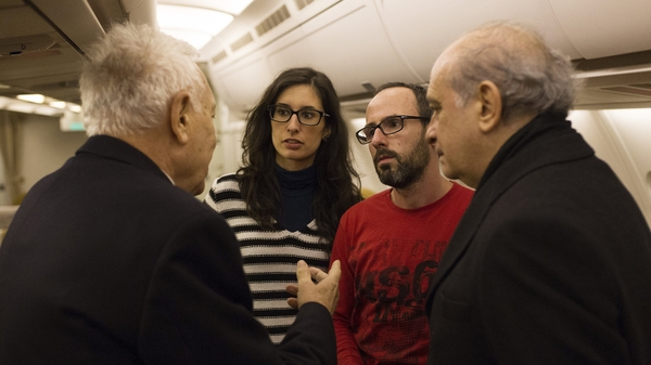 Spanish Home Minister (R) and Spanish Foreign Minister (L) chat with Spanish tourists Cristina Rubio (2-L) and Juan Carlos Sanchez (2-R), both caught inside the National Bardo Museum during the attack