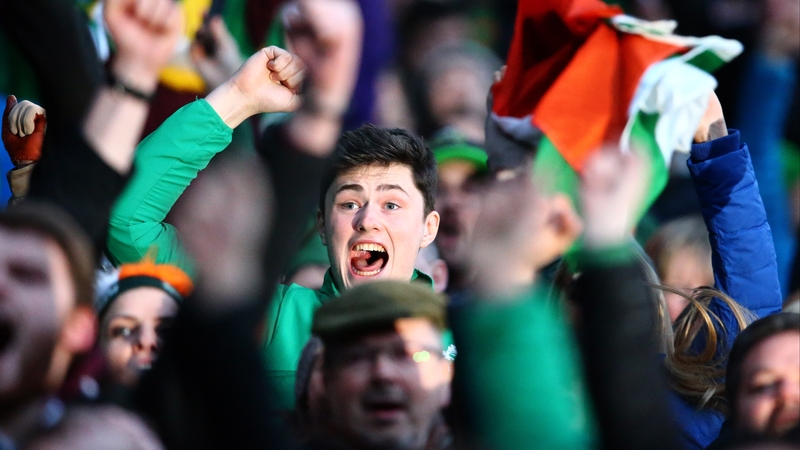 A supporter watches as England play France in the final act of Saturday's three-part drama