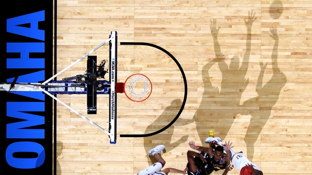 Shadows play ball during Kansas Jayhawks v Wichita State Shockers in the NCAA Tournament in Omaha, Nebraska