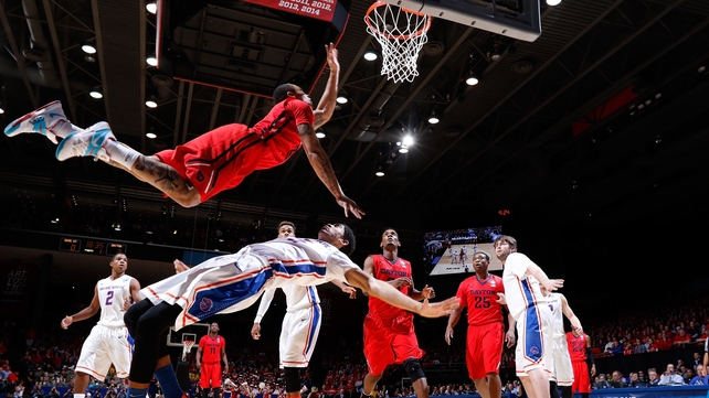 Kyle Davis of the Dayton Flyers goes to the basket against Chandler Hutchison of the Boise State Broncos during the NCAA Tournament at UD Arena in Dayton, Ohio