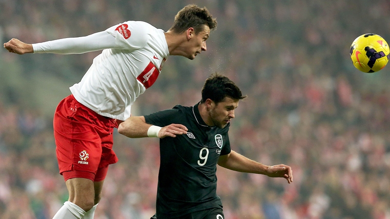 Ireland's Shane Long and Lukasz Szukala of Poland battle for the ball in 2013