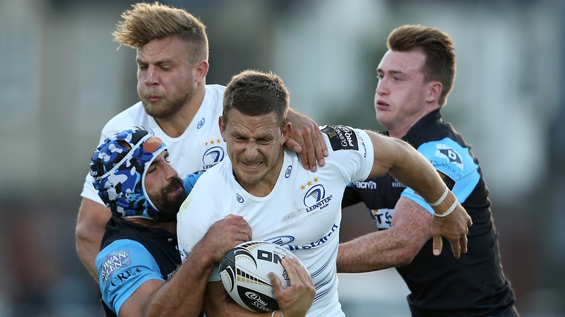 Leinster’s Jimmy Gopperth is tackled by Glasgow Warriors Josh Strauss and Stuart Hogg