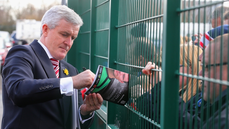Mark Hughes signs autographs for fans at Britannia Stadium