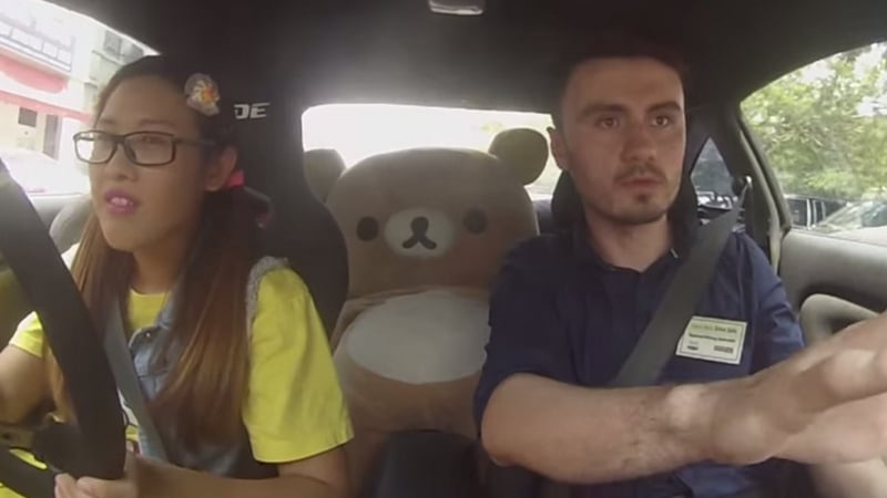 Leona Chin, a teddy bear and a driving instructor