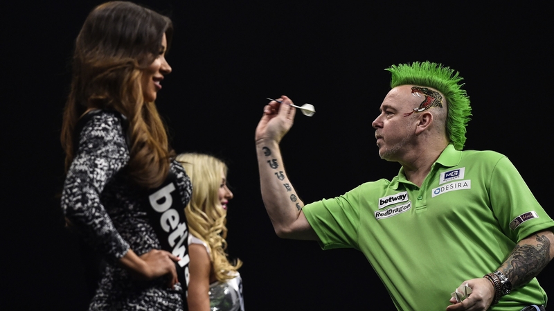 Peter Wright playing up to the locals in his (week-late) Paddy's Day rig out with matching mohican