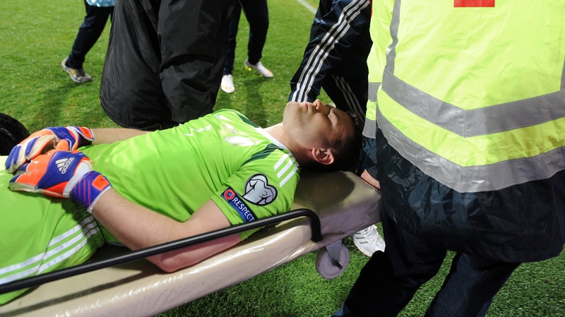 Russia goalkeeper Igor Akinfeev was hit on the head by a flare