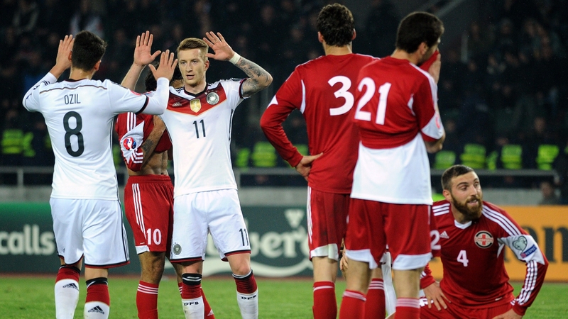 Marco Reus is congratulated on his goal by Mesut Ozil