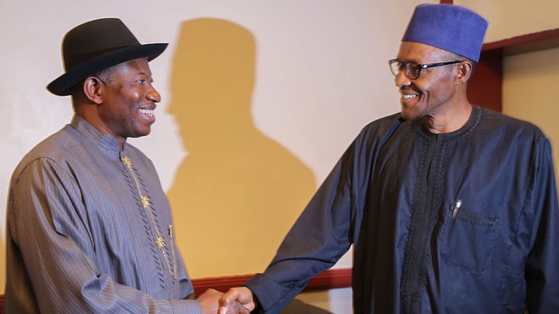 Goodluck Jonathan shakes hands with Muhammadu Buhari