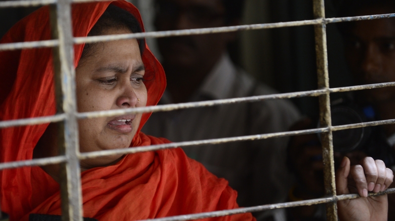 A relative of Washiqur Rahman reacts after seeing his body at Dhaka Medical College