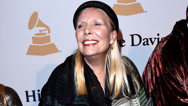 Joni Mitchell is described as being 'awake and in good spirits'