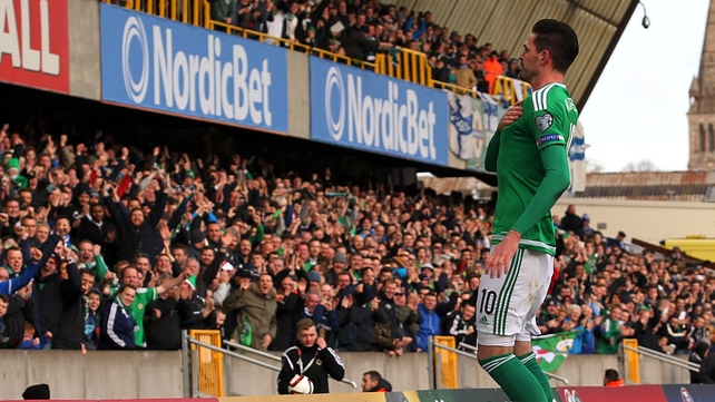 Kyle Lafferty celebrates in front of the home support as Northern Ireland beat Finland at Windsor Park