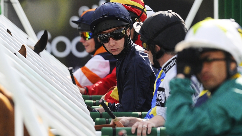 Joseph O'Brien pictured in navy blue in the stalls at Doncaster