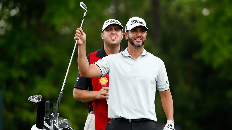 Scott Piercy and his caddie on the ninth tee