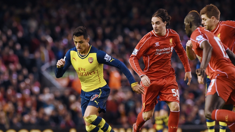 Arsenal's Alexis Sanchez torments Liverpool players during the game between the sides in December