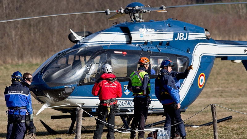 Alpine climbers take off in a police helicopter in Seyne Les Alpes, to search for the crash victims on 24 March
