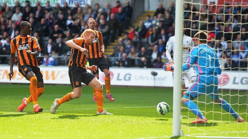 Paul McShane scores Hull's goal in the 3-1 defeat at Swansea