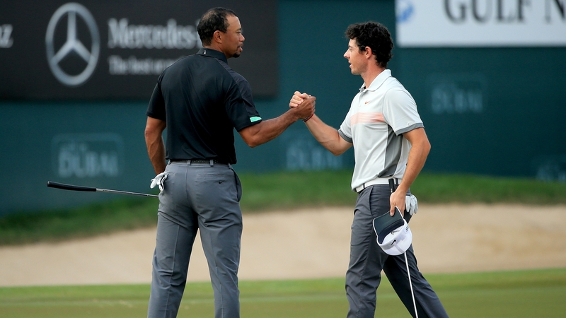 Tiger Woods (L) and Rory McIlroy