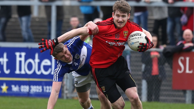 Down's Conor Laverty in action against Damian Strong of Laois