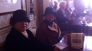 Women in traditional dress enjoy a coffee at Wynn's Hotel