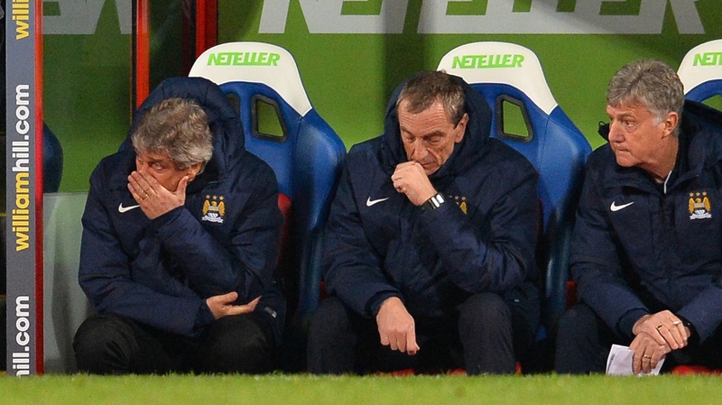Manuel Pellegrini (L) reacts during Man City's loss at Crystal Palace